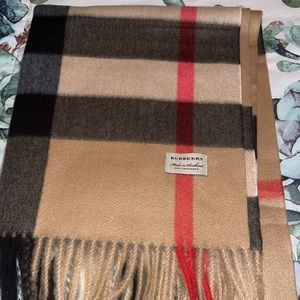 Slightly worn Burberry Wool Silk Scarf.